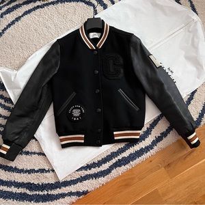 Beautiful wool coach bomber jacket with leather sleeves.